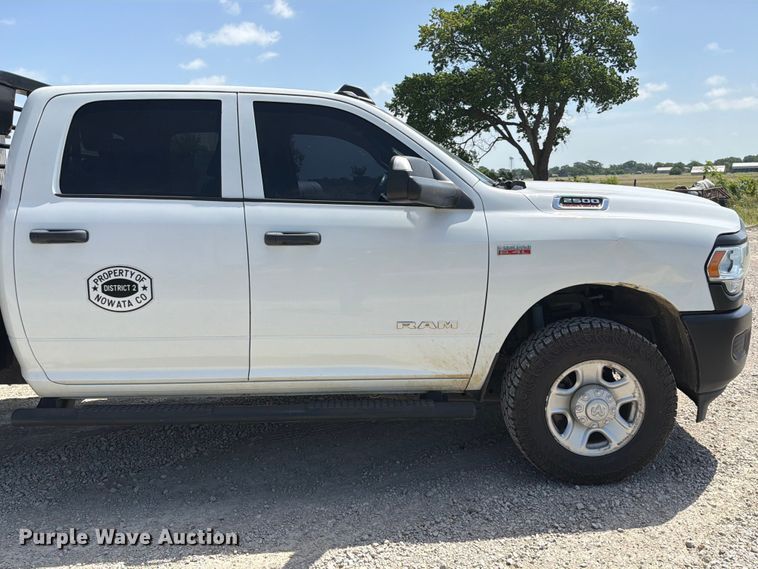 image for item EX2515 2021 RAM 2500 Heavy Duty Crew Cab flatbed pickup truck