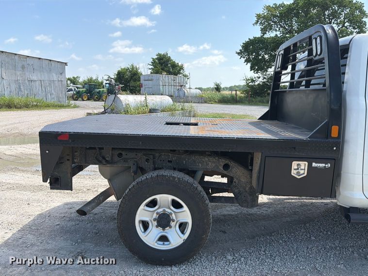 image for item EX2515 2021 RAM 2500 Heavy Duty Crew Cab flatbed pickup truck