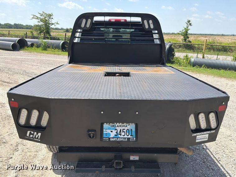 image for item EX2515 2021 RAM 2500 Heavy Duty Crew Cab flatbed pickup truck