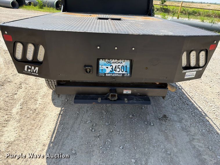 image for item EX2515 2021 RAM 2500 Heavy Duty Crew Cab flatbed pickup truck