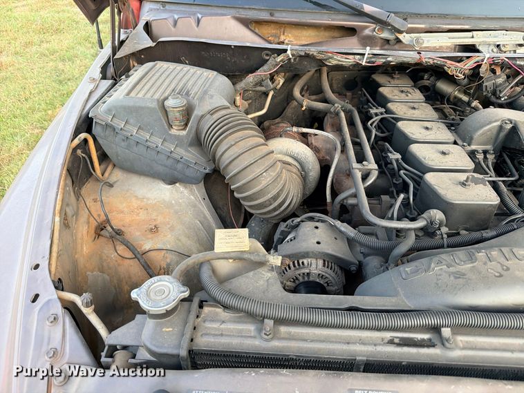 image for item FB8282 1997 Dodge Ram 3500 Ext. Cab flatbed pickup truck