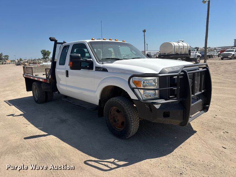 image for item NJ9248 2014 Ford F350  Super Duty XL Ext. Cab dump flatbed pickup truck