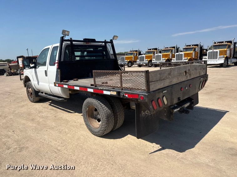 image for item NJ9248 2014 Ford F350  Super Duty XL Ext. Cab dump flatbed pickup truck