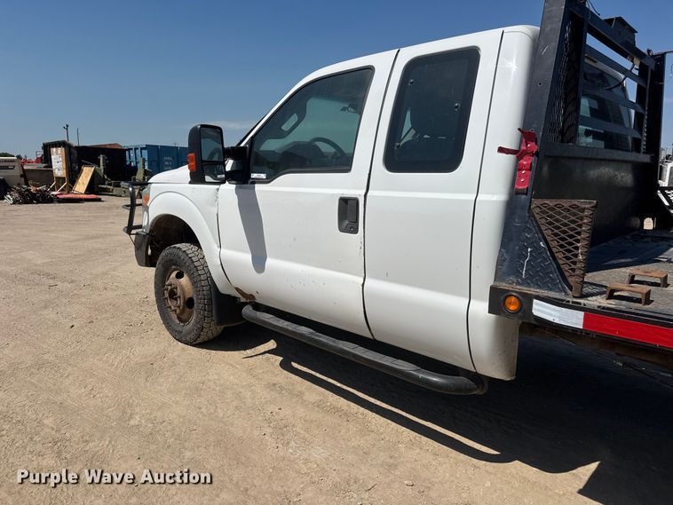 image for item NJ9248 2014 Ford F350  Super Duty XL Ext. Cab dump flatbed pickup truck