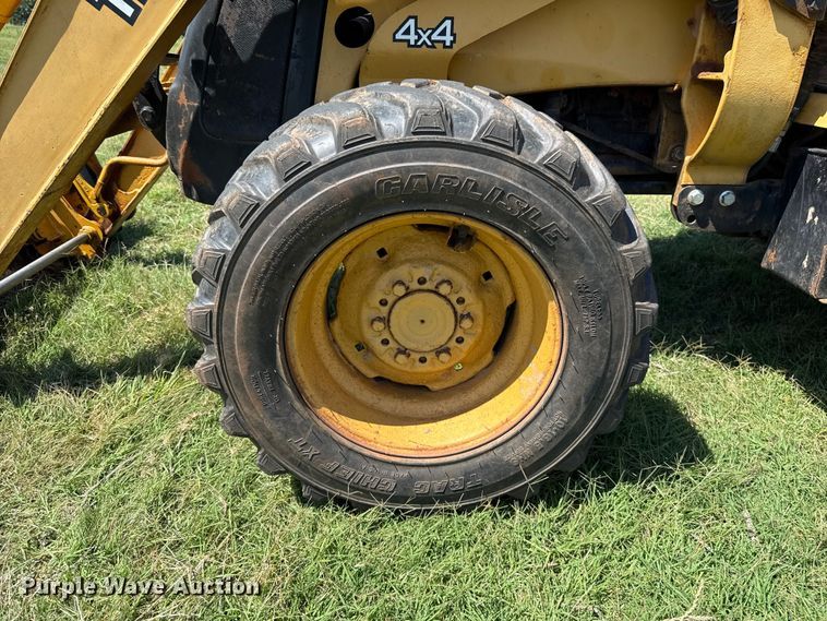 image for item ET6457 2004 John Deere 110 backhoe