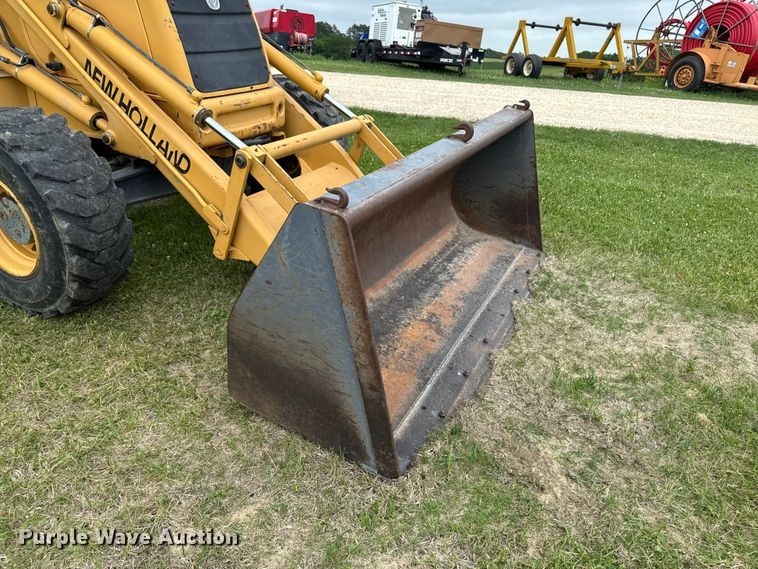 image for item FB5741 1999 New Holland 555E backhoe