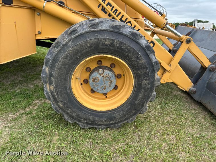 image for item FB5741 1999 New Holland 555E backhoe