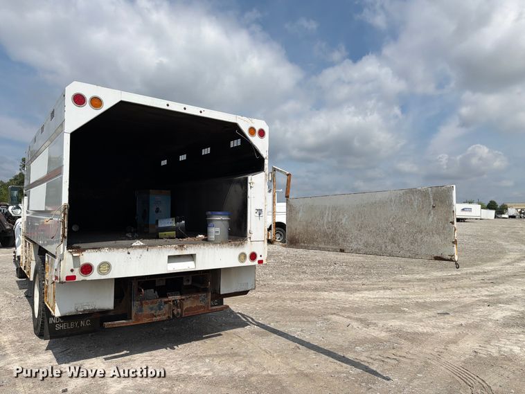 image for item YA3709 2015 Ford F650 Super Duty Ext. Cab chipper truck