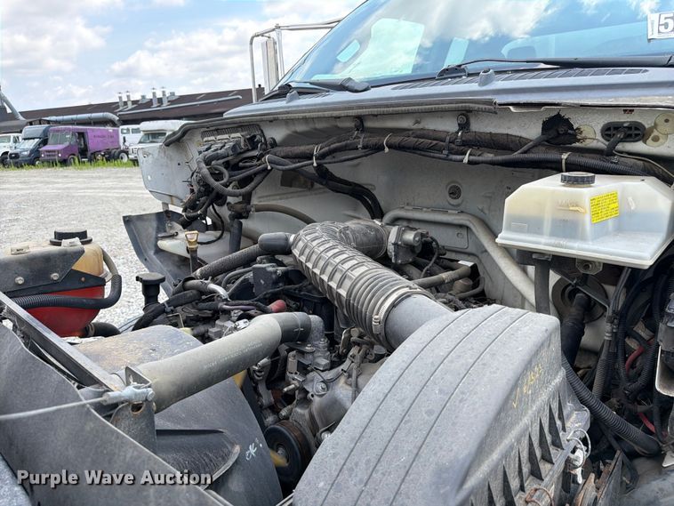 image for item YA3709 2015 Ford F650 Super Duty Ext. Cab chipper truck