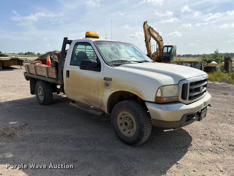 image for item EX2514 2004 Ford F250 Super Duty flatbed pickup truck