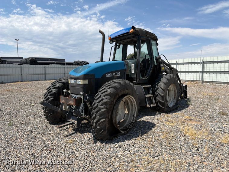 1999 New Holland TV140 MFWD bi-directional tractor