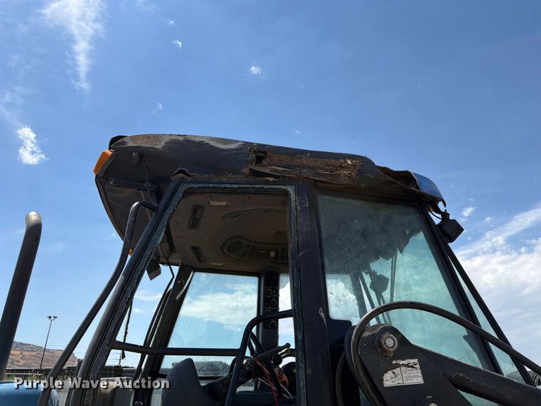 image for item YA4187 1999 New Holland TV140 MFWD bi-directional tractor