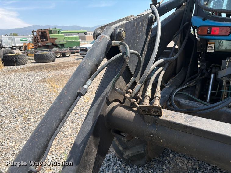 image for item YA4187 1999 New Holland TV140 MFWD bi-directional tractor