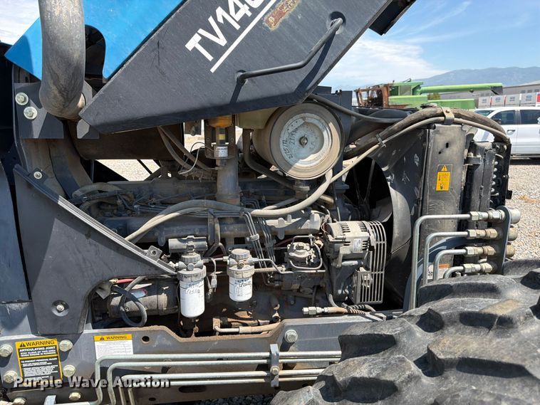 image for item YA4187 1999 New Holland TV140 MFWD bi-directional tractor