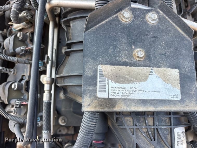 image for item ET0333 2014 Isuzu NPR roll-off container truck