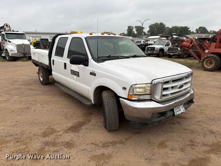 image for item ER1917 2000 Ford F250 Super Duty Crew Cab dump flatbed pickup truck