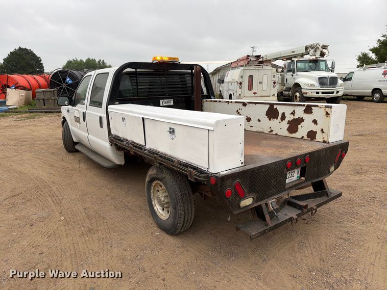 image for item ER1917 2000 Ford F250 Super Duty Crew Cab dump flatbed pickup truck