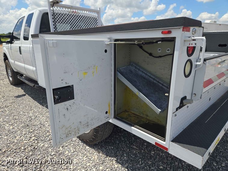image for item EW0464 2016 Ford F350 Super Duty Ext. Cab utility bed pickup truck
