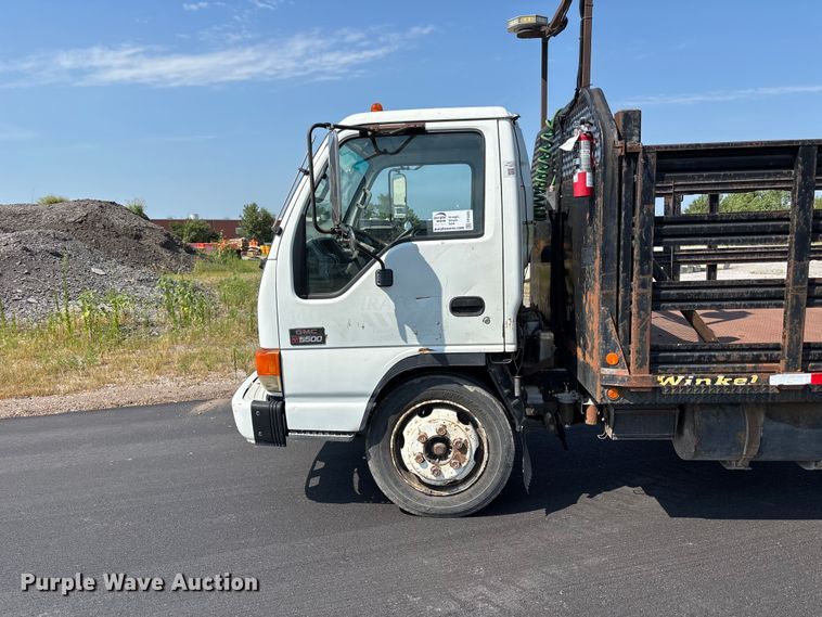 image for item FP3009 2004 GMC W5500 flatbed truck