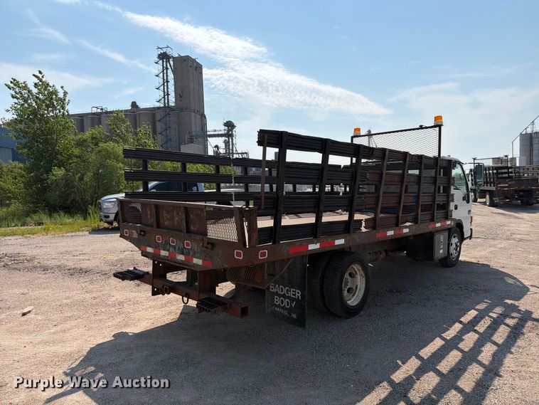 image for item FP3010 2002 GMC W5500 flatbed truck