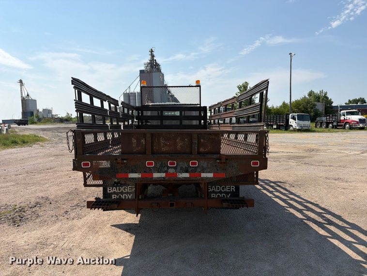 image for item FP3010 2002 GMC W5500 flatbed truck