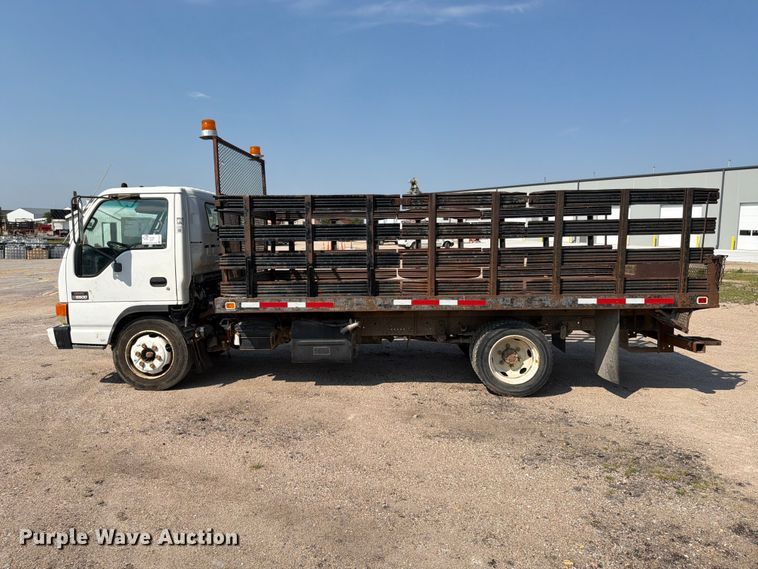 image for item FP3010 2002 GMC W5500 flatbed truck