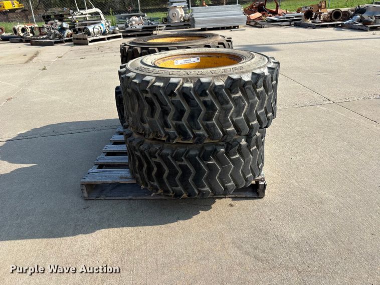 image for item NM9922 (4) 12-16.5 tires and wheels
