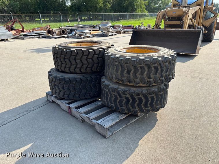 image for item NM9922 (4) 12-16.5 tires and wheels