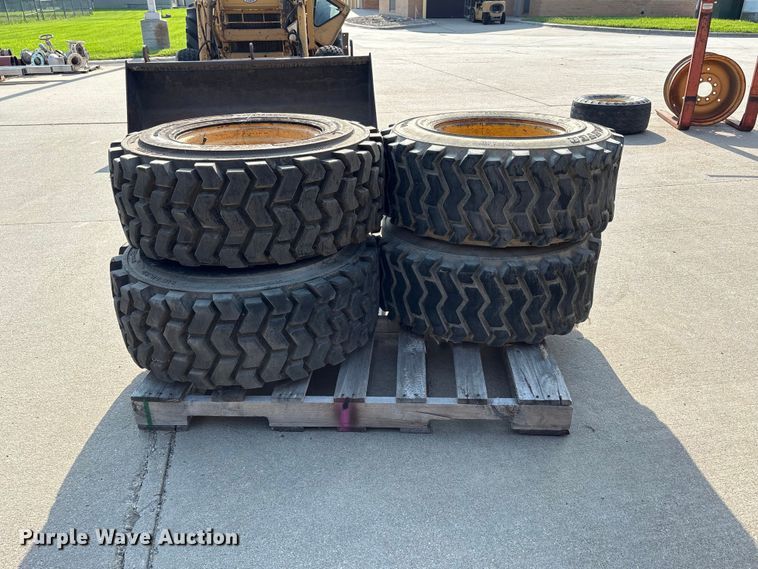image for item NM9922 (4) 12-16.5 tires and wheels