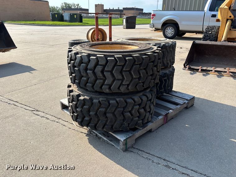 image for item NM9922 (4) 12-16.5 tires and wheels