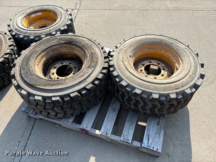 image for item NM9922 (4) 12-16.5 tires and wheels