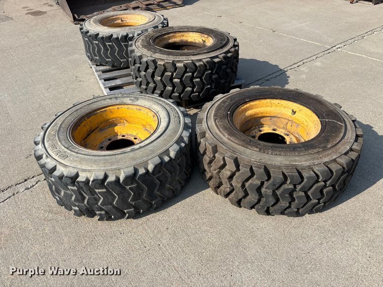 image for item NM9922 (4) 12-16.5 tires and wheels