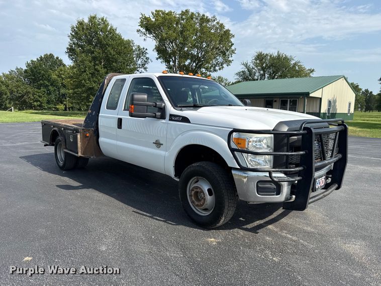 image for item FC4121 2011 Ford F350 Ext. Cab flatbed pickup truck