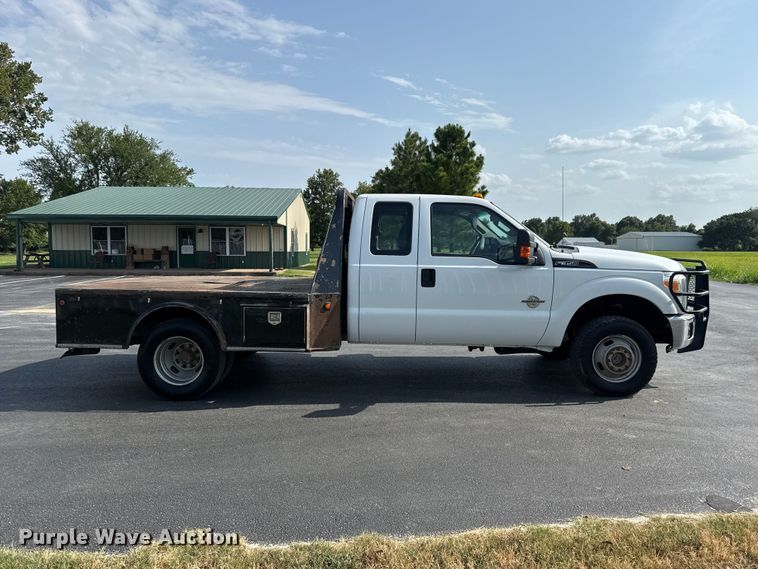 image for item FC4121 2011 Ford F350 Ext. Cab flatbed pickup truck