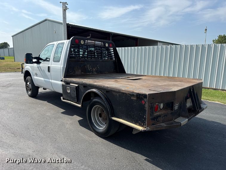 image for item FC4121 2011 Ford F350 Ext. Cab flatbed pickup truck