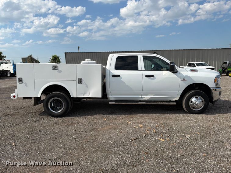 image for item EG9273 2024 RAM 3500 Heavy Duty Crew Cab utility bed pickup truck