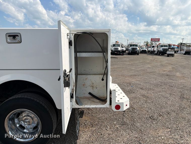 image for item EG9273 2024 RAM 3500 Heavy Duty Crew Cab utility bed pickup truck
