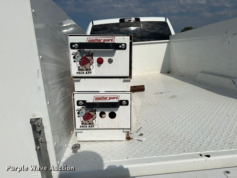 image for item EG9273 2024 RAM 3500 Heavy Duty Crew Cab utility bed pickup truck