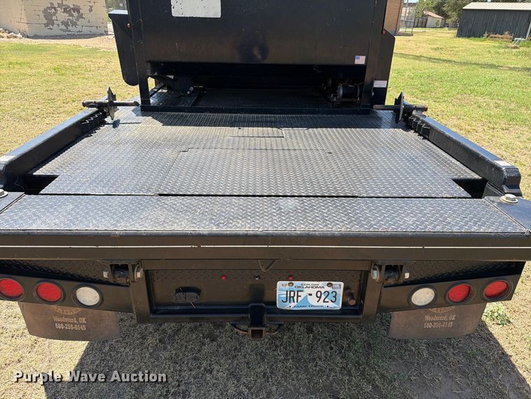 image for item EW8733 2022 Chevrolet Silverado 3500HD Crew Cab flatbed pickup truck