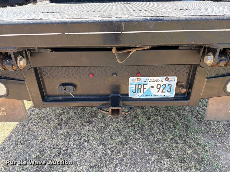 image for item EW8733 2022 Chevrolet Silverado 3500HD Crew Cab flatbed pickup truck