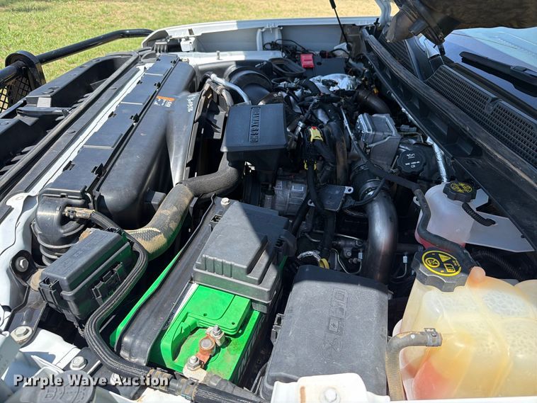 image for item EW8733 2022 Chevrolet Silverado 3500HD Crew Cab flatbed pickup truck