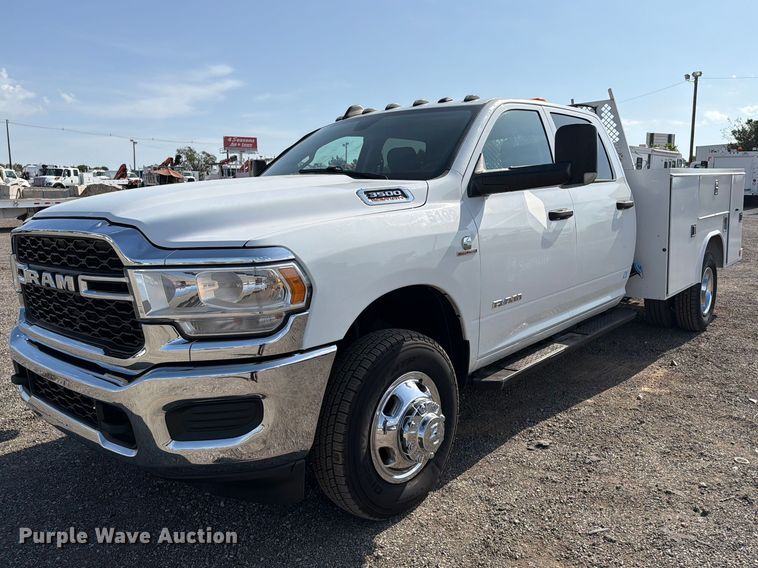 image for item FB5058 2019 RAM 3500 Heavy Duty Crew Cab utility bed pickup truck