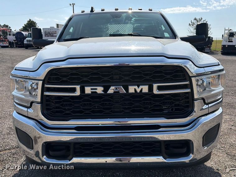 image for item FB5058 2019 RAM 3500 Heavy Duty Crew Cab utility bed pickup truck