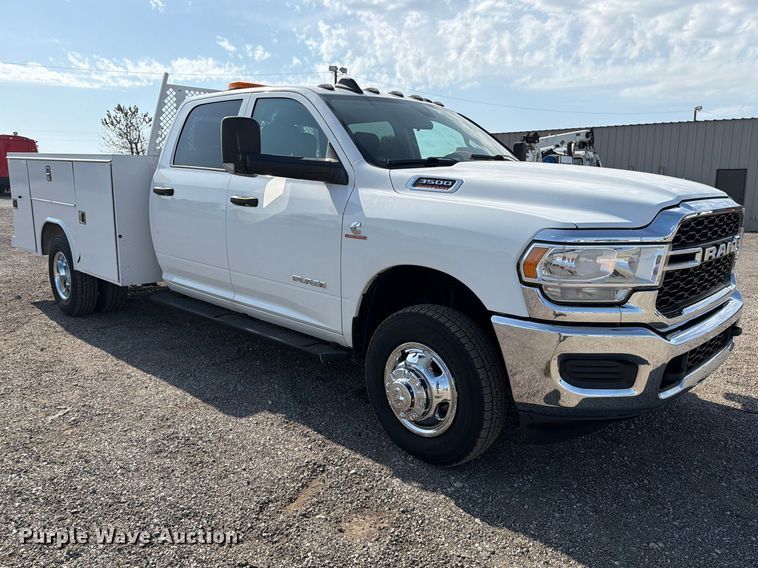 image for item FB5058 2019 RAM 3500 Heavy Duty Crew Cab utility bed pickup truck
