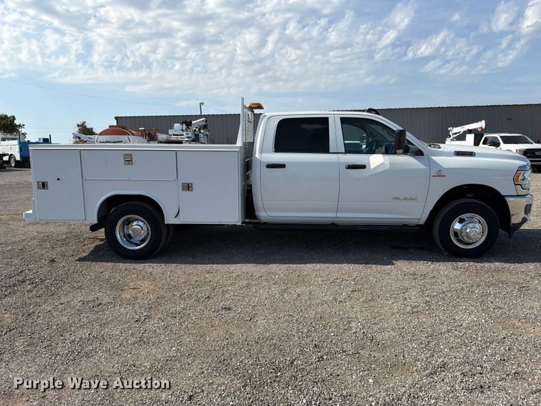 image for item FB5058 2019 RAM 3500 Heavy Duty Crew Cab utility bed pickup truck
