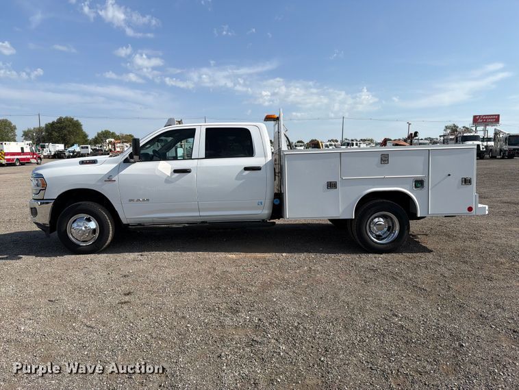 image for item FB5058 2019 RAM 3500 Heavy Duty Crew Cab utility bed pickup truck