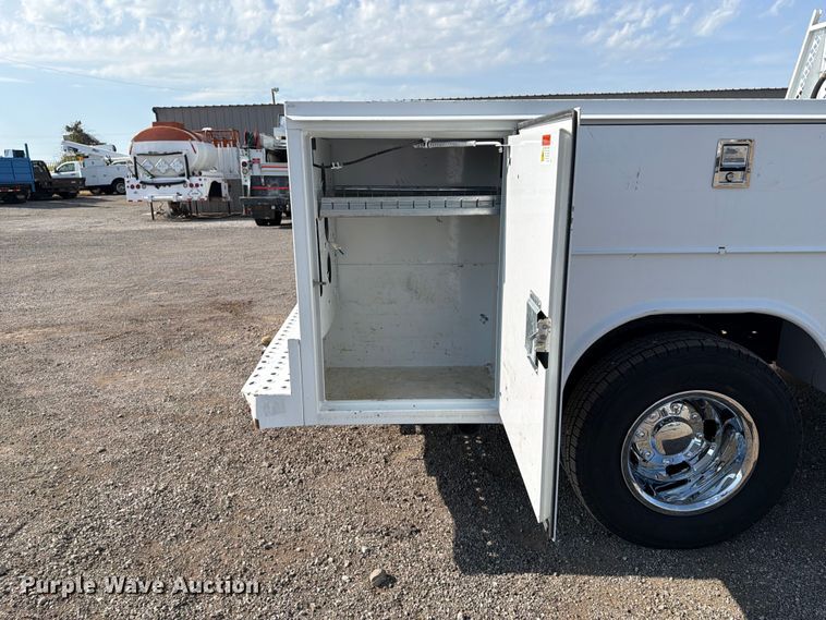 image for item FB5058 2019 RAM 3500 Heavy Duty Crew Cab utility bed pickup truck