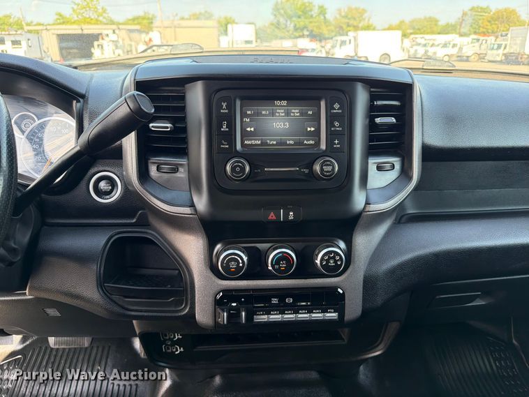image for item FB5058 2019 RAM 3500 Heavy Duty Crew Cab utility bed pickup truck