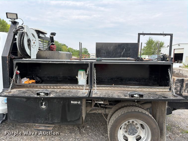 image for item FN5798 2022 RAM 5500 Crew Cab flatbed truck