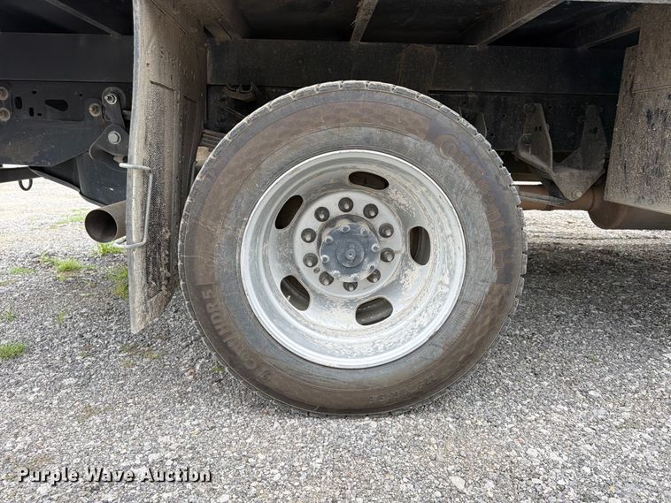 image for item FN5798 2022 RAM 5500 Crew Cab flatbed truck